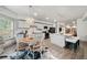 Open kitchen and dining area featuring white cabinets and a chandelier over the dining table at 829 Waterford Estates Mnr, Canton, GA 30115