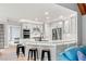 Bright kitchen with stainless appliances, white cabinetry, and bar stool seating at 829 Waterford Estates Mnr, Canton, GA 30115