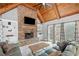 Comfortable living room with stone fireplace and bright natural light at 829 Waterford Estates Mnr, Canton, GA 30115