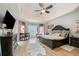 Spacious main bedroom with a tray ceiling, lots of natural light, and stylish furnishings at 829 Waterford Estates Mnr, Canton, GA 30115