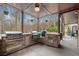Outdoor kitchen with built-in grills, stone counters, and a covered patio area for entertaining at 829 Waterford Estates Mnr, Canton, GA 30115