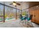 This outdoor patio provides seating and a relaxing space, with a pool and wooded area in the background at 829 Waterford Estates Mnr, Canton, GA 30115