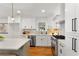 Contemporary kitchen featuring white cabinets, stainless appliances, and ample counter space at 1020 Pinedale Se Dr, Smyrna, GA 30080