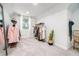 Walk-in closet with a modern design featuring clothing racks, a plant, and bright carpet at 1239 E Rock Springs Ne Rd, Atlanta, GA 30306