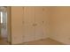 Bedroom featuring a double-door closet with brass hardware at 158 Weatherstone Dr, Woodstock, GA 30188
