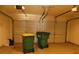 Garage featuring an automatic door and trash cans at 158 Weatherstone Dr, Woodstock, GA 30188