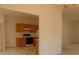 View of the kitchen featuring wood cabinets and modern appliances at 158 Weatherstone Dr, Woodstock, GA 30188