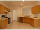 Spacious kitchen featuring wood cabinets and stainless steel appliances at 158 Weatherstone Dr, Woodstock, GA 30188