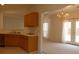 Open kitchen flowing into the living area with natural light and modern fixtures at 158 Weatherstone Dr, Woodstock, GA 30188