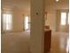 Open-concept living room featuring neutral walls, carpet, and a pass-through to the kitchen at 158 Weatherstone Dr, Woodstock, GA 30188