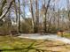 Well maintained picnic area features a table, seating and wooded surroundings at 158 Weatherstone Dr, Woodstock, GA 30188