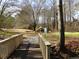 Community playground near bridge offers outdoor recreational opportunities at 158 Weatherstone Dr, Woodstock, GA 30188
