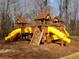 Community playground including fun slides and wooden structures at 158 Weatherstone Dr, Woodstock, GA 30188