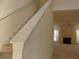 Bright entryway featuring a carpeted staircase and view into the living room with fireplace at 158 Weatherstone Dr, Woodstock, GA 30188