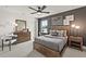 Stylish bedroom featuring dark tones, a ceiling fan, and a cozy atmosphere at 1605 Wander Ml, Cumming, GA 30040