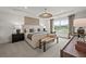 Elegant bedroom with a tray ceiling, shiplap accent wall, and a view of the outdoors at 1605 Wander Ml, Cumming, GA 30040
