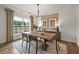 Bright dining room features modern chandelier, natural light, and stylish decor at 1605 Wander Ml, Cumming, GA 30040