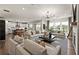 Spacious living room with a fireplace, hardwood floors and modern light fixtures at 1605 Wander Ml, Cumming, GA 30040