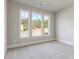 Bright bedroom with large windows providing ample natural light and neutral carpet at 38 Lakeview Pt, Dallas, GA 30157