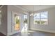 Bright dining area with an outdoor view and modern chandelier at 38 Lakeview Pt, Dallas, GA 30157