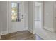 Inviting foyer featuring wood-look flooring and a view into a brightly lit room at 38 Lakeview Pt, Dallas, GA 30157