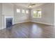 Spacious living room featuring a fireplace, ceiling fan, and hardwood flooring at 38 Lakeview Pt, Dallas, GA 30157