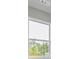 Close-up view of a double hung window with lush green trees visible outside at 38 Lakeview Pt, Dallas, GA 30157