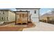 A view of the backyard with the covered porch, fenced perimeter and new driveway at 727 Garibaldi Sw St, Atlanta, GA 30310