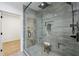Modern bathroom featuring a glass shower, elegant tiling, and dark fixtures at 727 Garibaldi Sw St, Atlanta, GA 30310