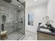 Modern bathroom featuring a glass shower, dark fixtures, and elegant tiling at 727 Garibaldi Sw St, Atlanta, GA 30310