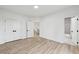 Bright bedroom featuring neutral walls, hardwood flooring, and double door closets at 727 Garibaldi Sw St, Atlanta, GA 30310