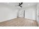 Bright bedroom featuring a ceiling fan, neutral walls, and hardwood flooring at 727 Garibaldi Sw St, Atlanta, GA 30310