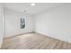 Bright bedroom featuring neutral walls, hardwood flooring, and natural light at 727 Garibaldi Sw St, Atlanta, GA 30310