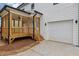 Beautiful exterior of home featuring a screened in porch and attached garage at 727 Garibaldi Sw St, Atlanta, GA 30310