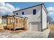 A view of the new construction with a covered back porch, and a large driveway at 727 Garibaldi Sw St, Atlanta, GA 30310