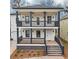 Beautiful two-story home with a charming double front porch and modern design elements at 727 Garibaldi Sw St, Atlanta, GA 30310