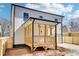 Back of the home featuring screened in porch and an attached garage at 727 Garibaldi Sw St, Atlanta, GA 30310
