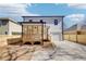 A view of the backyard with the covered porch, new driveway and fenced perimeter at 727 Garibaldi Sw St, Atlanta, GA 30310