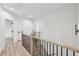 Hallway with wooden staircase and modern railing and doors at 727 Garibaldi Sw St, Atlanta, GA 30310