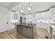 The kitchen features stainless appliances, a kitchen island, and modern lighting at 727 Garibaldi Sw St, Atlanta, GA 30310