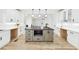 A kitchen with a kitchen island, stainless appliances, and modern lighting at 727 Garibaldi Sw St, Atlanta, GA 30310