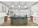 A kitchen with stainless steel appliances, plenty of counter space, a wine bottle and wine glass at 727 Garibaldi Sw St, Atlanta, GA 30310