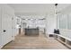 An open concept kitchen with modern lighting and a kitchen island at 727 Garibaldi Sw St, Atlanta, GA 30310