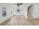 Bright living room features a tray ceiling, built-in shelving, and hardwood floors at 727 Garibaldi Sw St, Atlanta, GA 30310