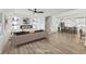 Open-concept living room and kitchen feature hardwood floors and a cozy fireplace at 727 Garibaldi Sw St, Atlanta, GA 30310