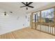 Relaxing screened porch with ceiling fan, natural light, and wood flooring at 727 Garibaldi Sw St, Atlanta, GA 30310