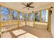Inviting screened-in porch with natural wood, ceiling fan, and views at 727 Garibaldi Sw St, Atlanta, GA 30310