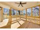 Inviting screened-in porch with natural wood, ceiling fan, and natural light at 727 Garibaldi Sw St, Atlanta, GA 30310
