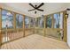 Bright and airy sunroom with hardwood flooring and large windows offering scenic views at 727 Garibaldi Sw St, Atlanta, GA 30310