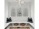Stylish built-in window seat with storage, lit by a unique light fixture for a cozy spot at 727 Garibaldi Sw St, Atlanta, GA 30310